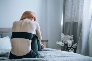 Woman struggling with an eating disorder